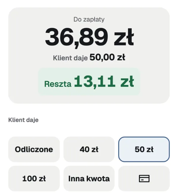 Покупець дає 50 zł, решта 13,11 zł великими цифрами.